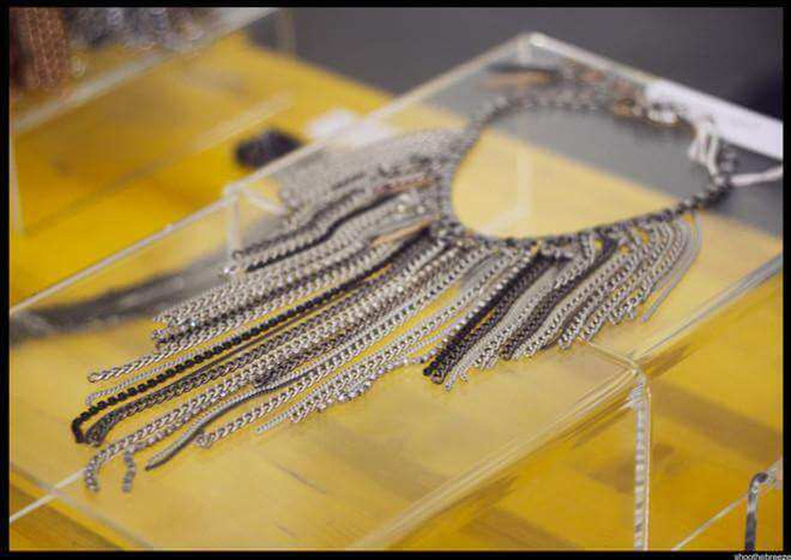 "Exquisite Chain Fringe Necklace with Antique Silver and Brass Chains, Studs, Rhinestone Crystals, and Charms - a Must-Have for Fashionistas!"